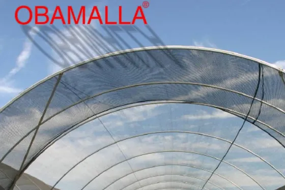 OBAMALLA shade cloth over a greenhouse structure